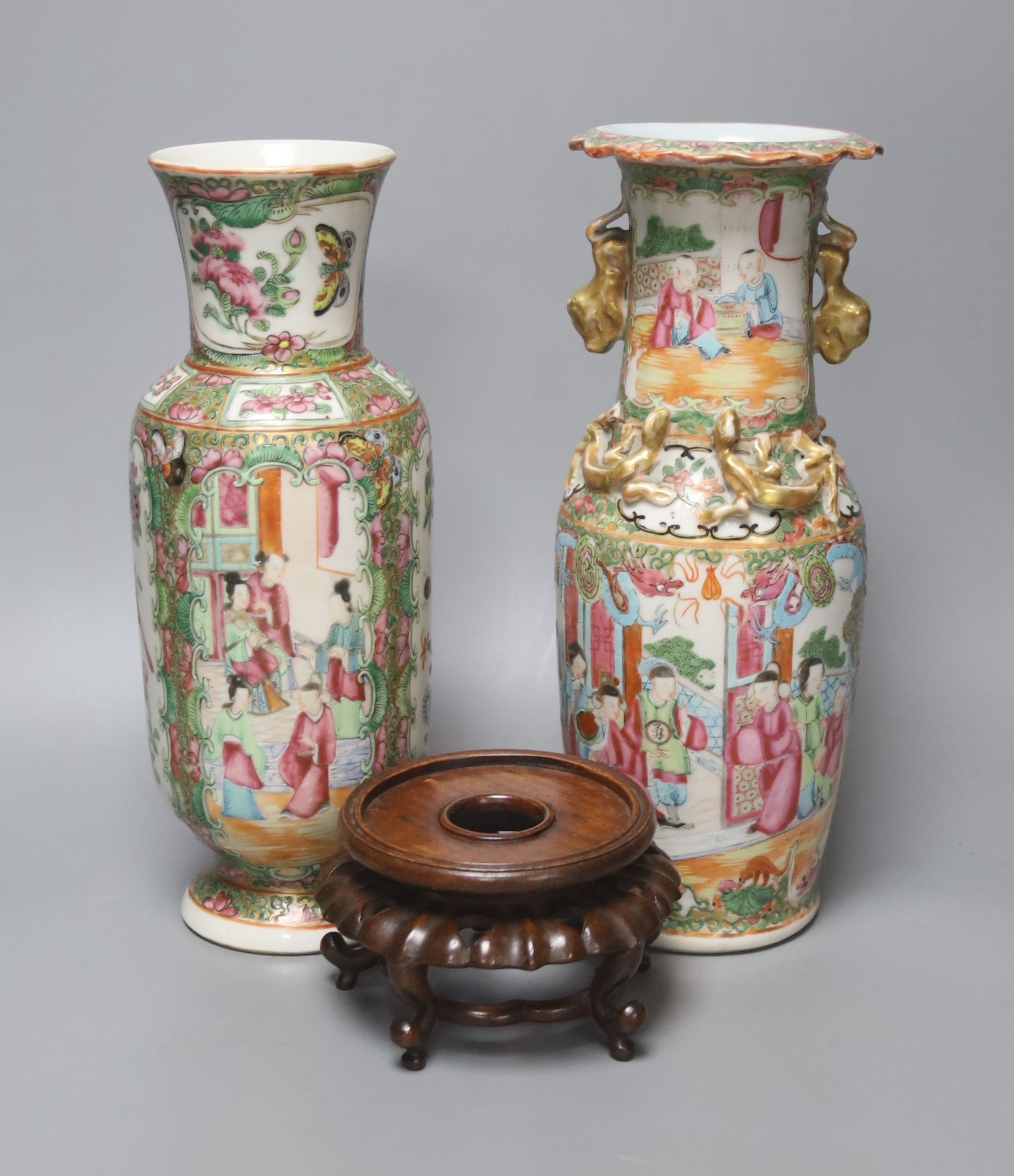 Two Chinese famille rose vases, late 19th century, tallest 26 cm, one wood stand, some restoration